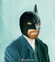 a painting of a man with a beard wearing a black batman mask and blue jacket