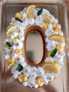 a cake decorated with lemons and white frosting