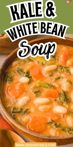 A spoonful of kale, white beans, and carrots from a rich and creamy soup.