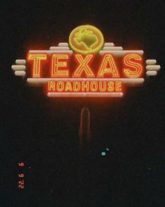 a neon sign that reads texas roadhouse