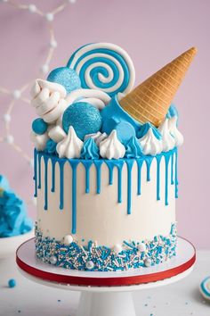 Fun Blue Drip Cake with Ice Cream Cone and Candy Decorations