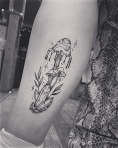 a black and white photo of a mushroom tattoo