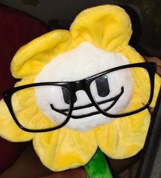 a stuffed animal with glasses on it's face