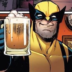 a man in a wolverine costume holding a glass of beer
