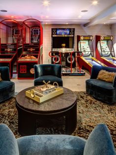 a room filled with furniture and arcade machines