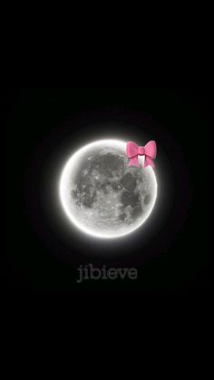a pink bow on top of the moon
