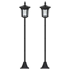 two black street lights with one light on each side and the other on top of it