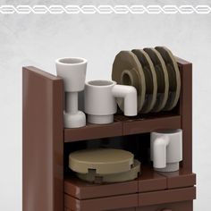 there is a lego kitchen set with dishes and cups on the shelf next to it