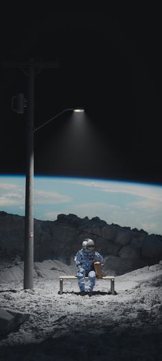 an astronaut sitting on a bench in front of a street light at night with the moon behind him