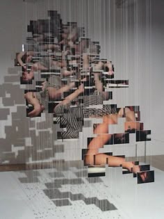 an art installation with multiple images of people in the middle and on top of each other