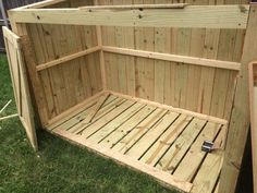 a wooden bench sitting on top of a lush green field