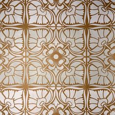 an intricately designed wallpaper in gold and white