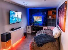 a bed room with a neatly made bed and a flat screen tv mounted on the wall