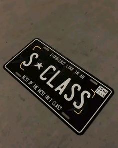 a black license plate with the word class written on it