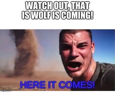 a man with his mouth open in front of a dust cloud that says watch out, that is wolf is coming here it comes