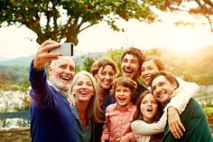 a family taking a selfie with their cell phone