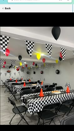 a room filled with black and white checkered tables