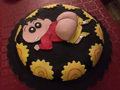 there is a cake that has been decorated to look like a cartoon character on it