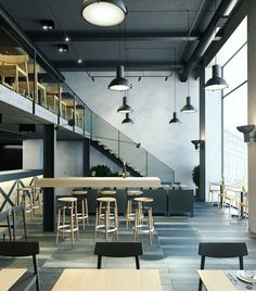an empty restaurant with tables and stools in front of the stairs, under lights