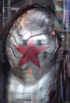 an iron man mask with red star on it