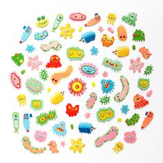 a bunch of different colored stickers on a white surface