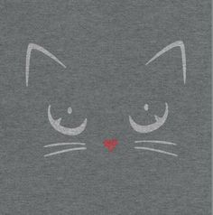 a gray t - shirt with a cat's face drawn on it