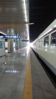 the train is stopped at the station waiting for passengers
