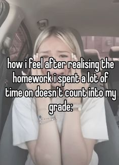 a woman sitting in the back seat of a car with her hands on her face