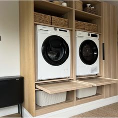 a washer and dryer are sitting on shelves