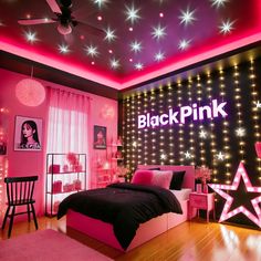 a bedroom decorated in pink and black with stars on the ceiling, lights around the bed