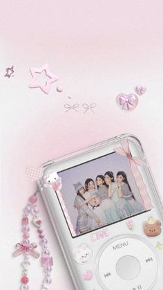 an mp3 player is laying on its side next to some beads and other things that are around it