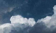 the sky is filled with clouds and stars