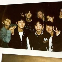 a group of young men standing next to each other