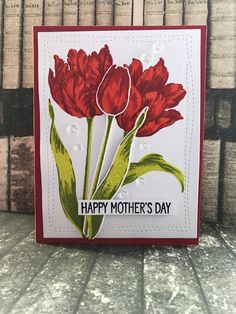 a card with red flowers and the words happy mother's day written on it