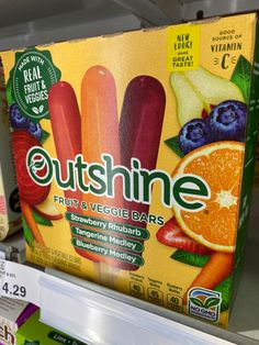 an assortment of fruit and veggie bars for sale in a grocery store shelf