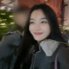 a blurry photo of a woman with long black hair