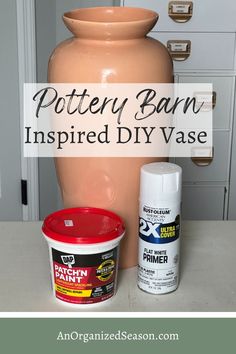 pottery barn inspired diy vase with paint and primer next to it on a kitchen counter