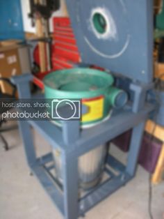 a bucket sitting on top of a metal table