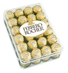 a clear box filled with gold foiled chocolates