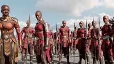 a group of men in armor standing next to each other