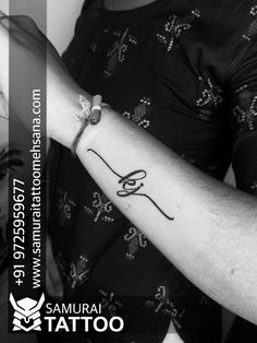 a woman with a tattoo on her arm