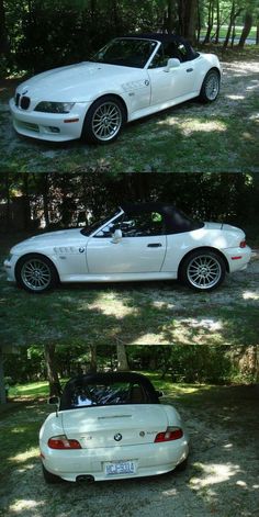 three different cars parked in the grass near trees