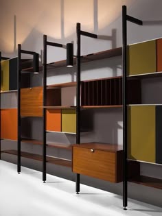 an assortment of shelves and shelving units in various colors