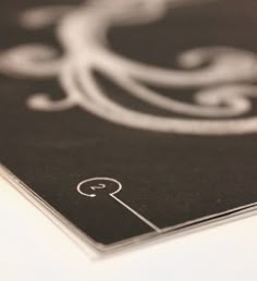 a black and white photo with the letter q on it's back side is shown