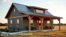 a small house with a metal roof in the middle of an open field at sunset