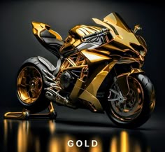 a shiny gold motorcycle is shown in this image