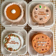 four plastic trays filled with different types of cakes
