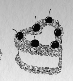 two cakes with cherries on top are drawn in black and white, while the rest of the drawing appears to be crocheted
