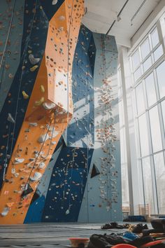 an indoor climbing wall in the middle of a building