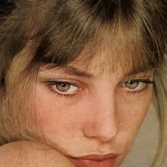 a close up of a person with blue eyes